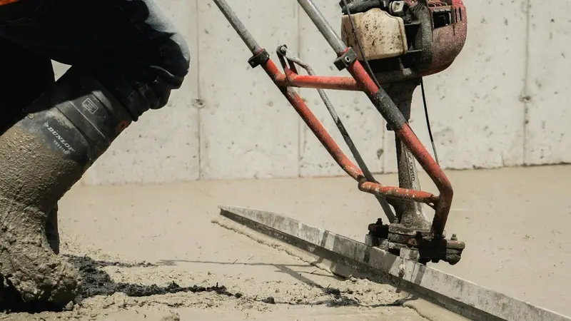 Concrete being leveled during a pour